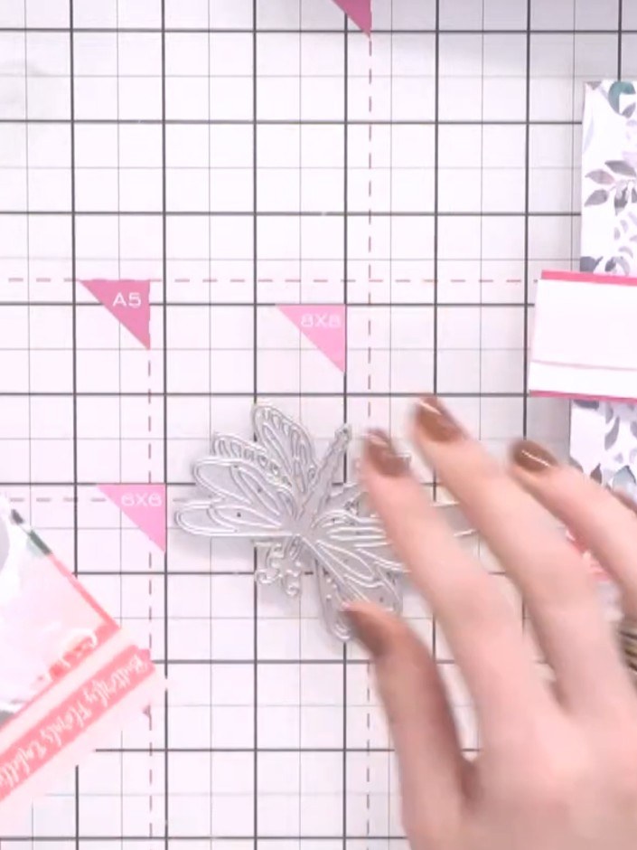 Step 7: Die-cut the dragonfly embellishments from teal and white card stock using the layered dies from the collection