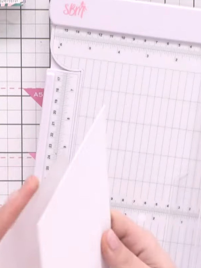 Step 3: Trim the embossed card pieces so the edges are flush and neat. Score along the hinge line with an embossing to