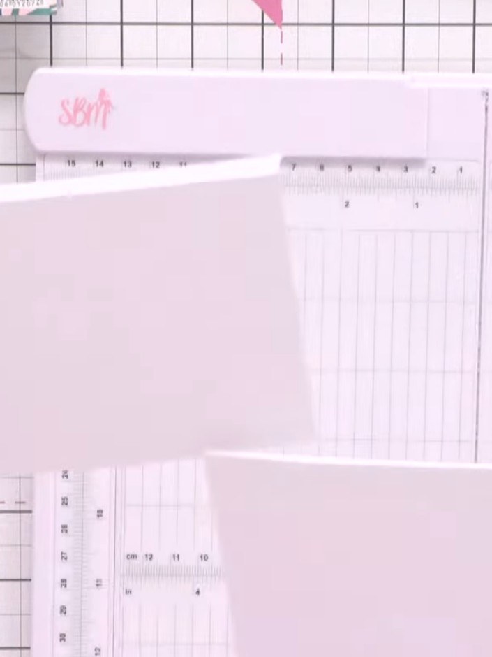 Step 5: Take two 7x7 inch white card blanks and place them together. Use a scoring board to align and position them, t