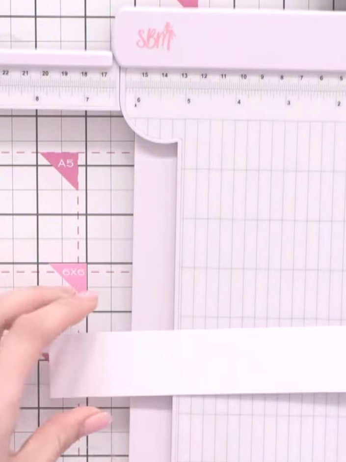 Step 9: Cut a strip of white card stock approximately 1.5 inches (4 cm) wide to create a belly band. Wrap it around th