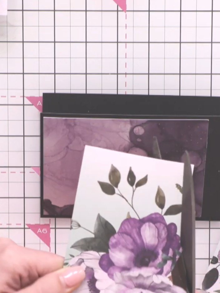 Step 4: Fussy-cut the purple flowers from the patterned paper using small, sharp scissors. Cut carefully around the pe