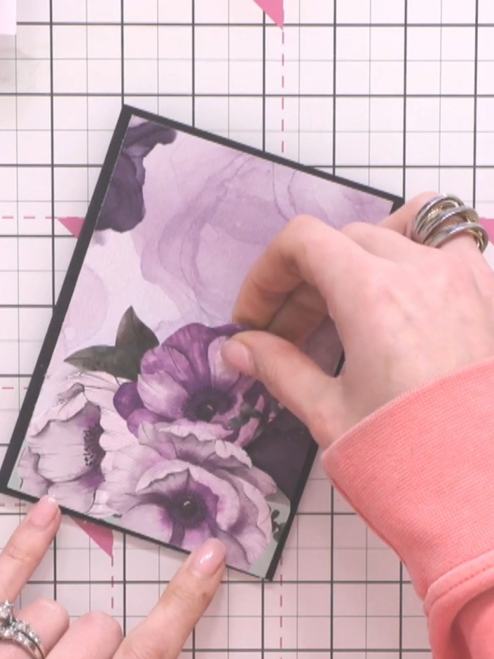 Step 6: Glue the fussy-cut purple flowers onto the alcohol ink mount panel to create your floral embellishment. Positi