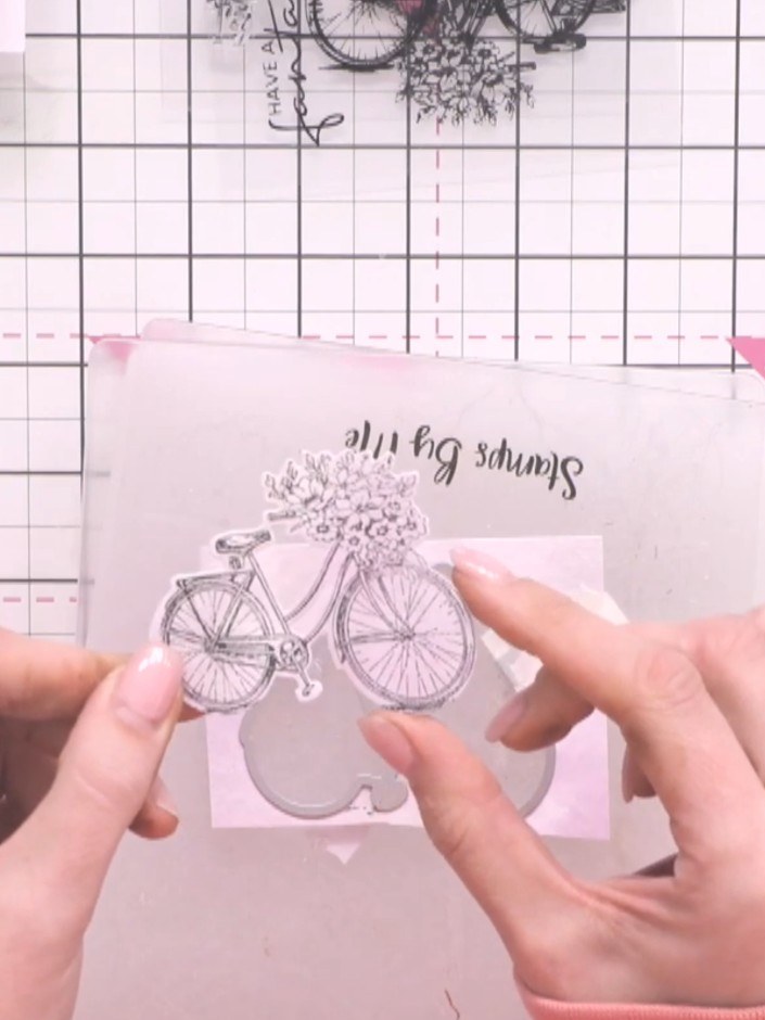 Step 5: Remove the die-cut bike image from the die-cutting machine. Carefully peel away the excess card from around th