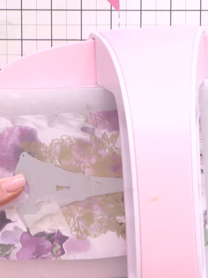 Step 8: Place your trimmed papers into the die-cutting machine and run them through to create clean, precise cuts of t