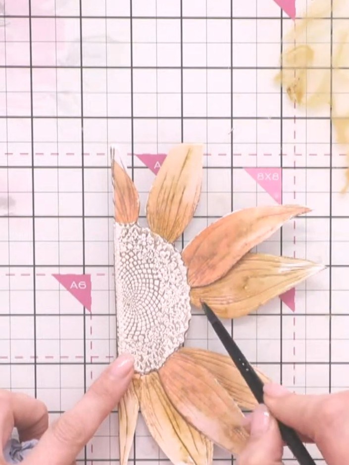 Step 11: Paint the third layer petals with the darkest brown tones, adding shadows and dimension where the petals overl