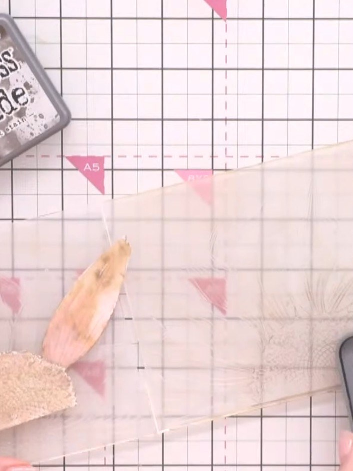 Step 15: Re-ink your embossing folder with Distress Oxide ink and run the painted flower piece through the embossing ma