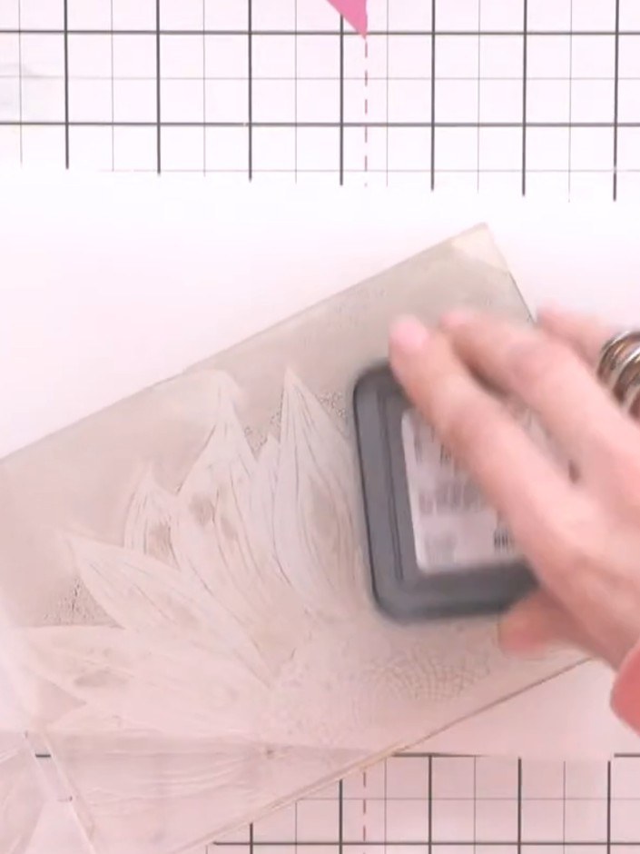 Step 5: Re-ink the embossing folder one final time using the ink pad. Run the third piece of card through the embossin