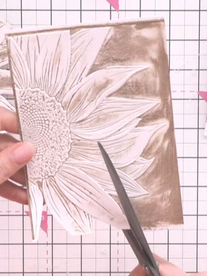 Step 7: Fussy cut the second sunflower piece with more detail, carefully cutting away some of the inner petals and lea