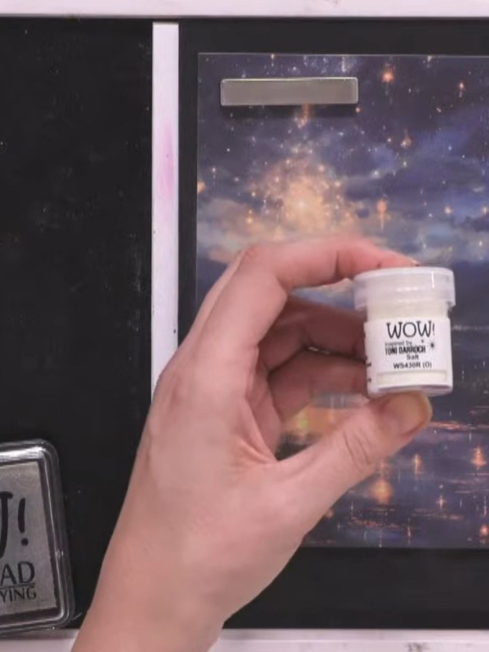 Step 4: Stamp the reflection and fireworks design firmly onto the galaxy paper using the WOW embossing pad. Ensure goo