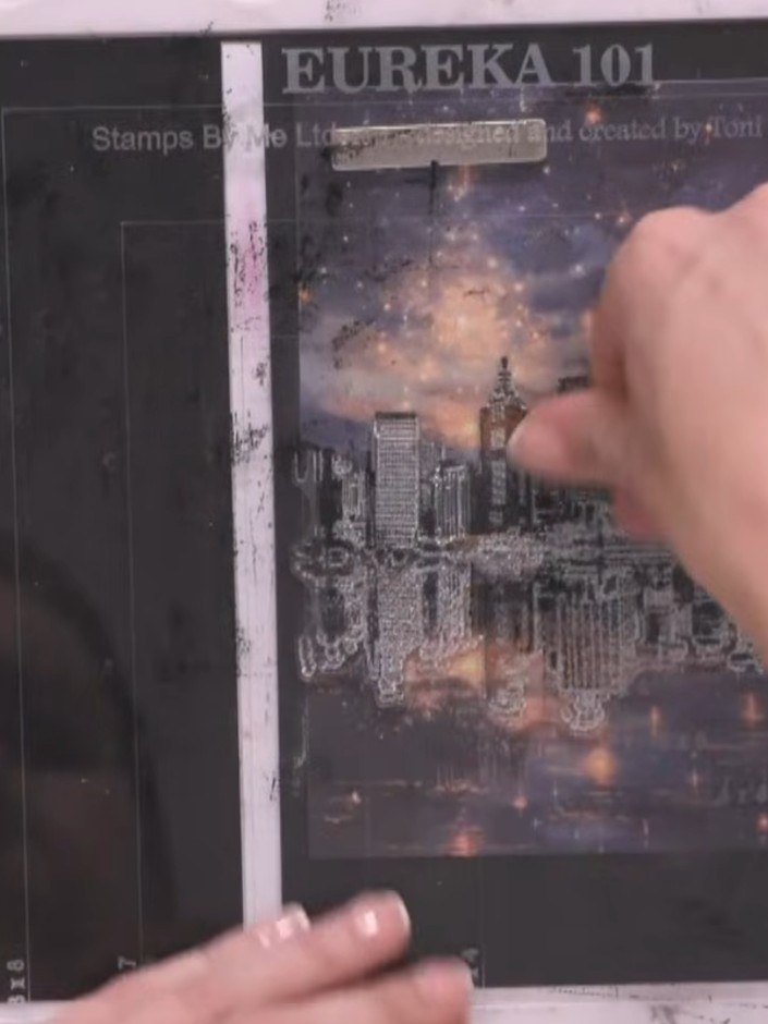 Step 5: Sprinkle salt-coloured WOW embossing powder (a white and iridescent mix) generously over the wet stamped citys