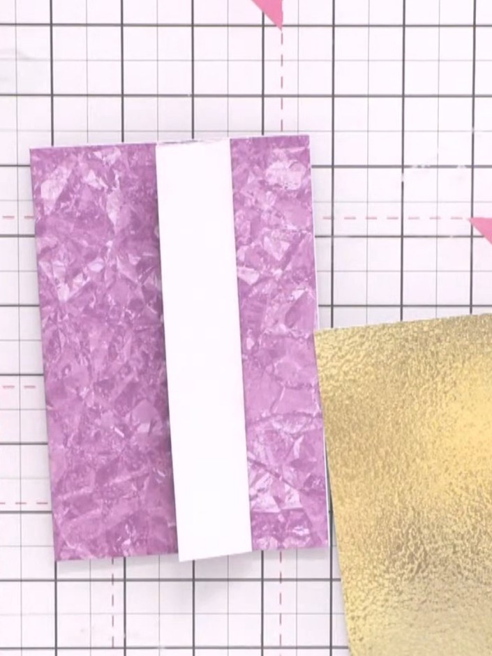 Step 6: Cut a bookmark from the gold foiled card to approximately 5.25 inches (13.5 cm) long. Place the bookmark into 