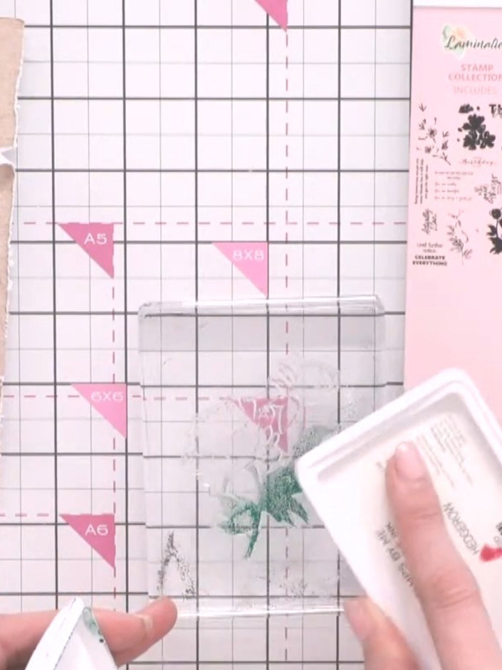 Step 2: Ink up the green base layer of the floral stamp using a green ink pad. Apply the ink evenly across the stamp s