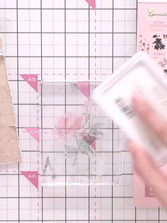 Step 3: Add pink ink to the flower head portion of the stamp, then add a touch of orange ink to create colour variatio