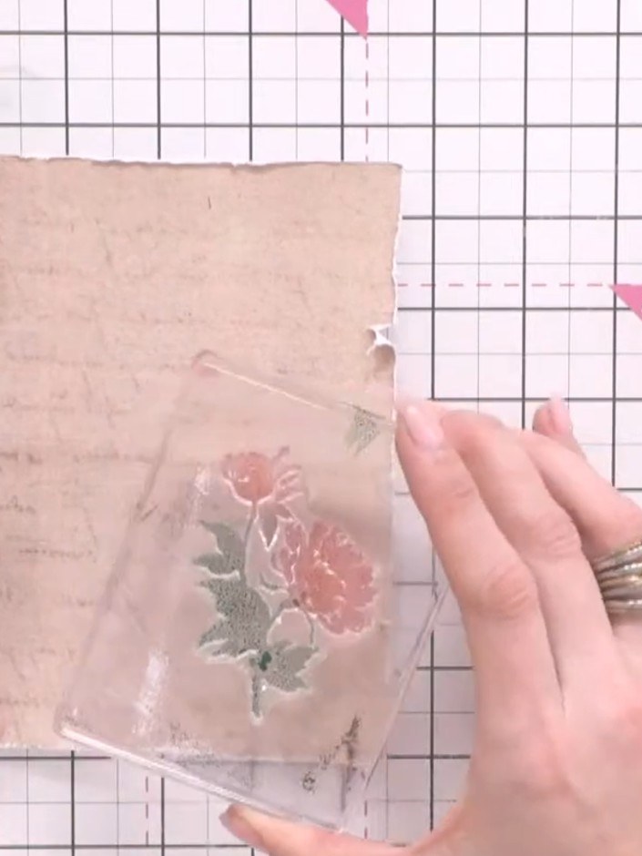 Step 5: Press the floral stamp firmly onto the bottom corner of your kraft card, allowing the ink to soak into the pap