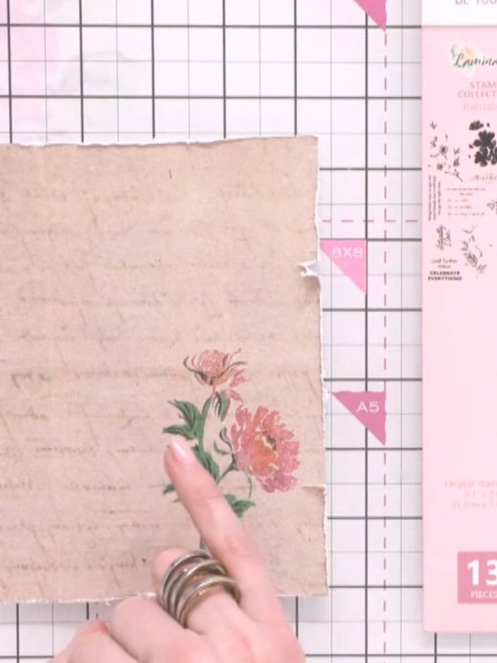 Step 8: Carefully line up the detail stamp over the coloured flower image on the kraft card. Press down firmly to add 