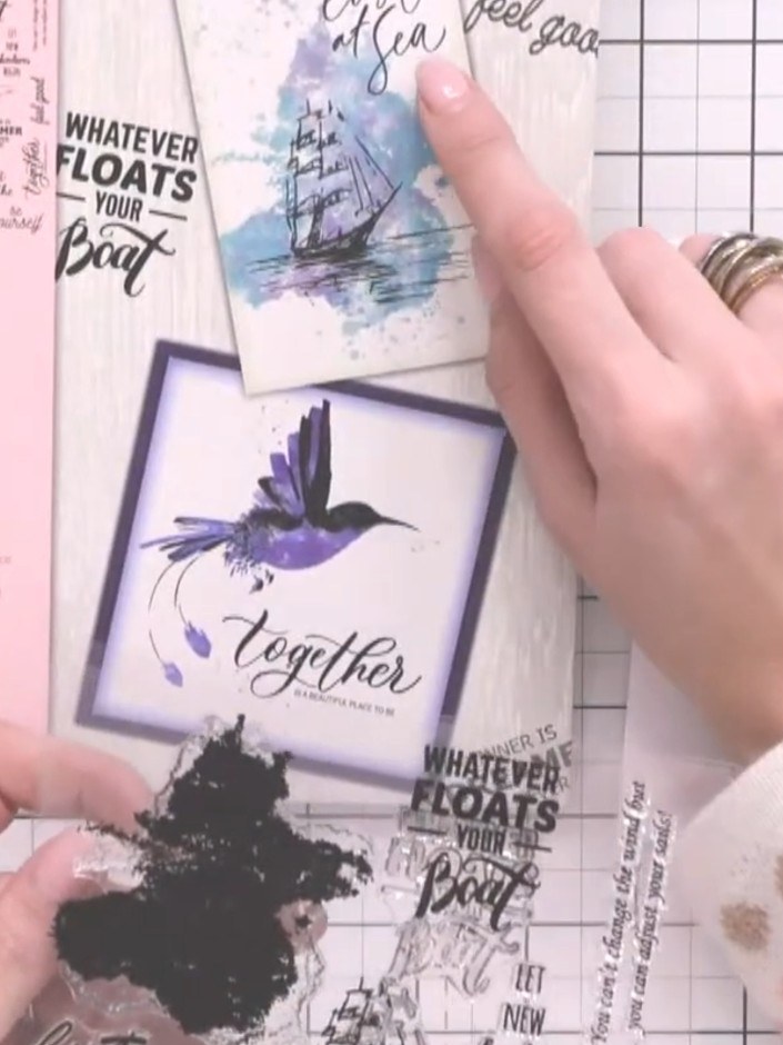 Step 2: Ink up the coloured base layer of the boat stamp with tea and teal ink pads, spotting colour around the stamp 