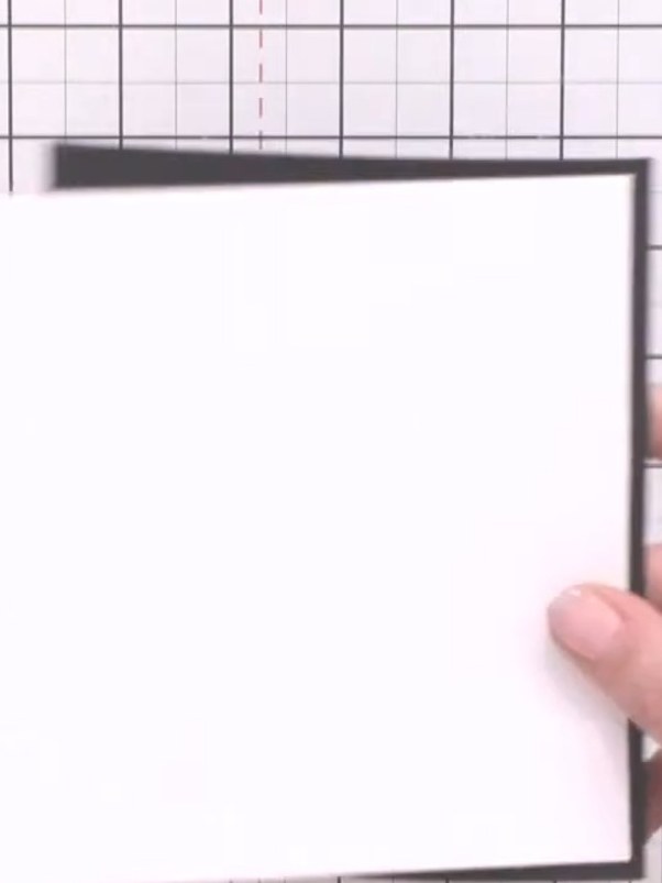 Step 1: Place a square of black cardstock on your cutting mat as the base for your card. This will provide high contra