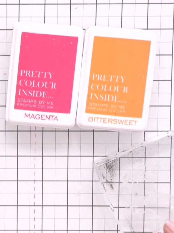Step 2: Ink up the coloured base layer of the bird stamp with Magenta and Bittersweet ink pads, applying the colours d