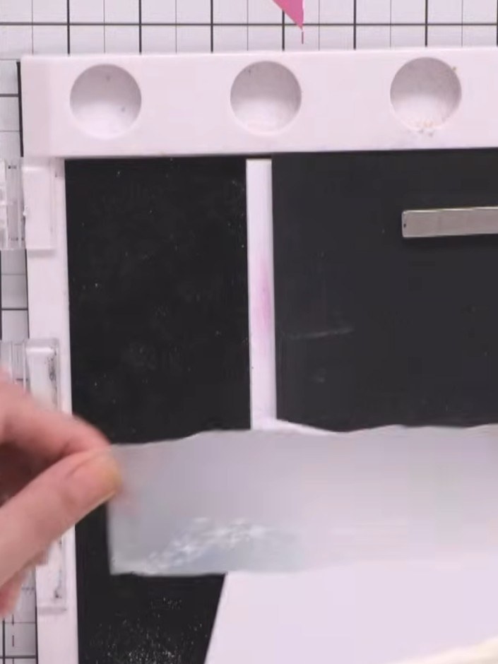 Step 4: Stamp the stars onto the vellum using embossing powder. Layer the star stamps to create a continuing pattern a