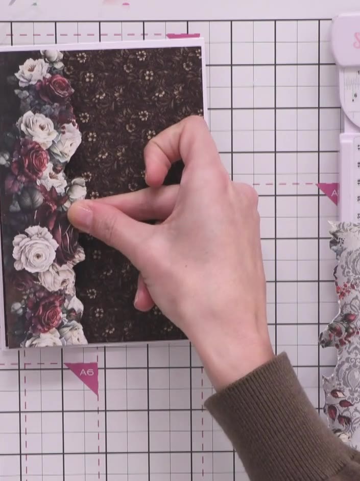 Step 6: Die-cut the wallet closure piece from the contrasting leather-effect patterned paper, ensuring the embossed de