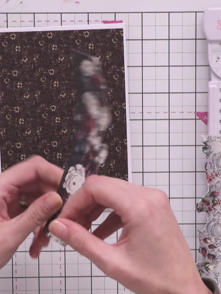 Step 9: Attach the closure piece to the front of the wallet using glue. Position it so it can wrap around to hold the 