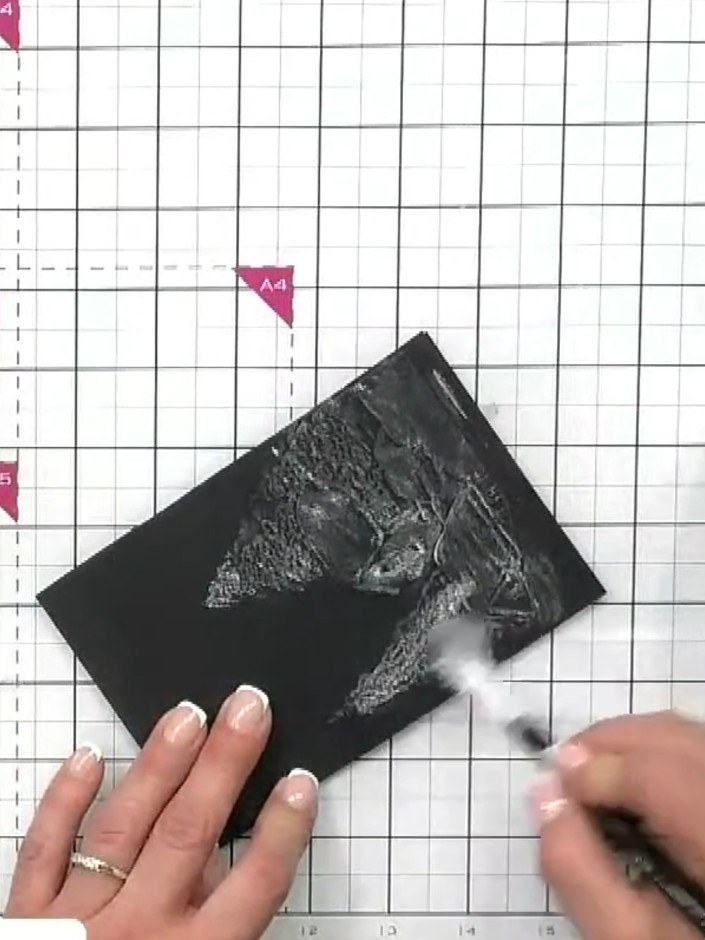 Step 5: Build up the texture paste in layers across the embossed design, allowing each layer to create a snowfall effe