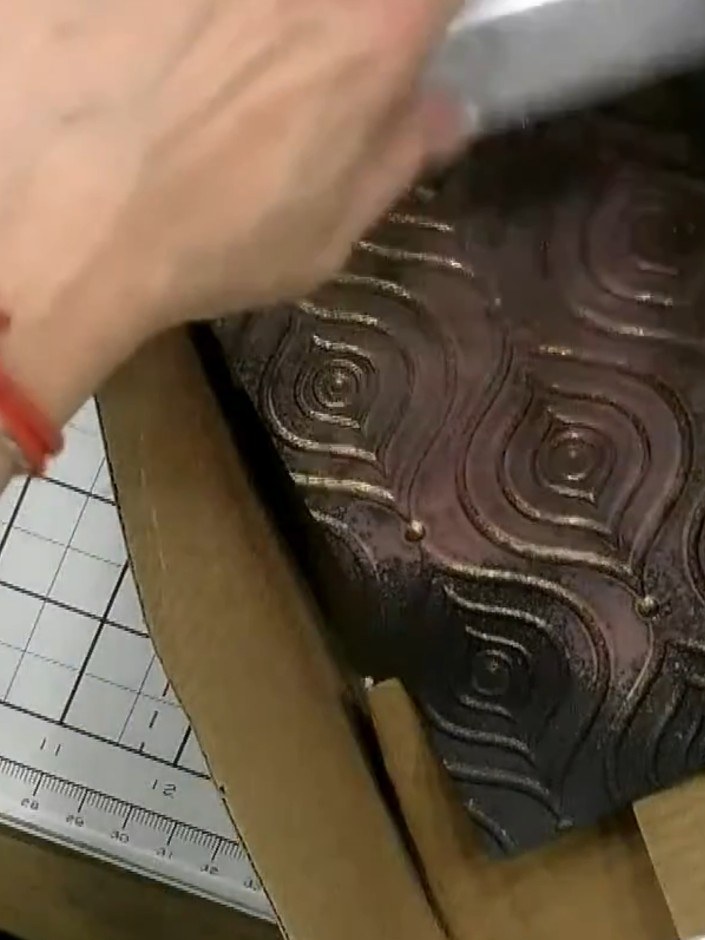 Step 1: Run black cardstock through your die-cutting machine with a decorative embossing folder to create a raised pat