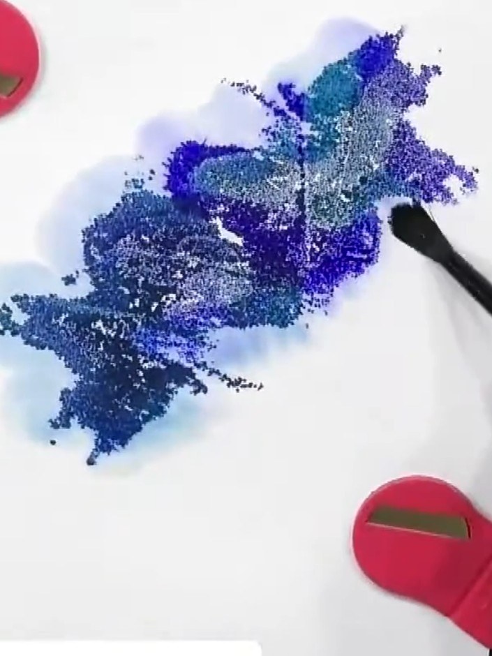 Step 7: Stamp the main scene (such as a sailing boat) on top of the dried watercolour background using the colour stam