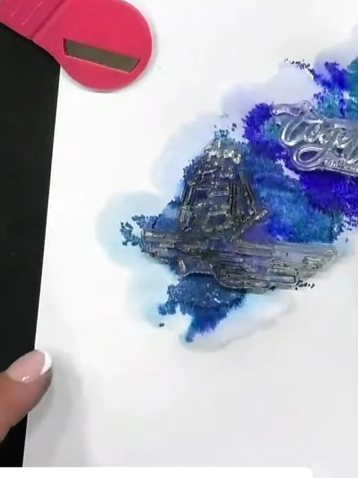 Step 9: Use a white gel pen to add highlights and details to your stamped image, such as moonlight on the water or sta