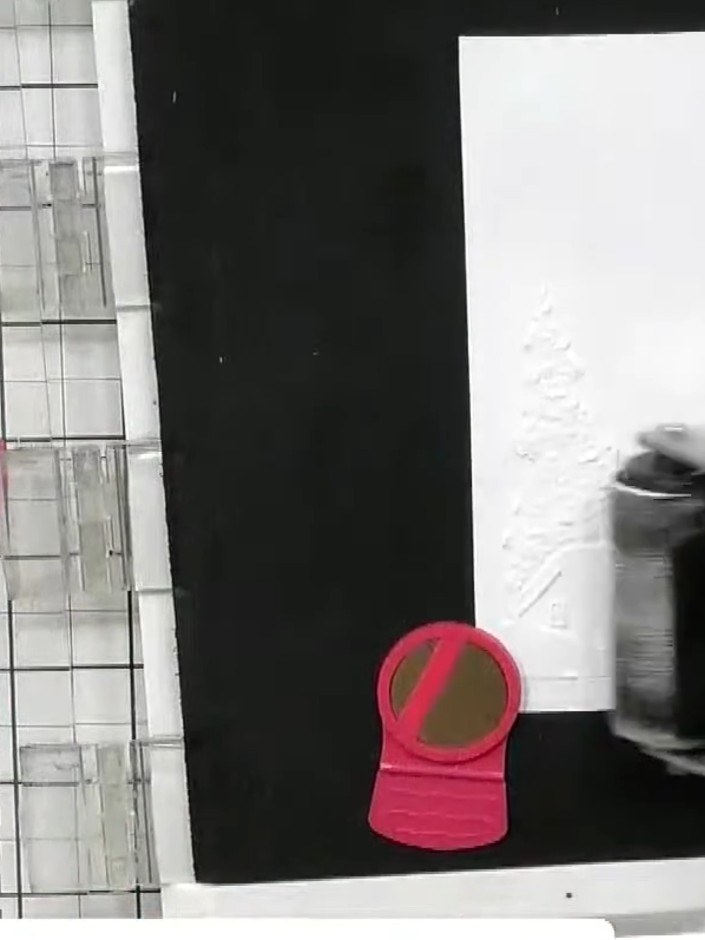 Step 2: Lightly apply midnight black ink using a brayer over the embossed surface. Work gently to bring out the detail
