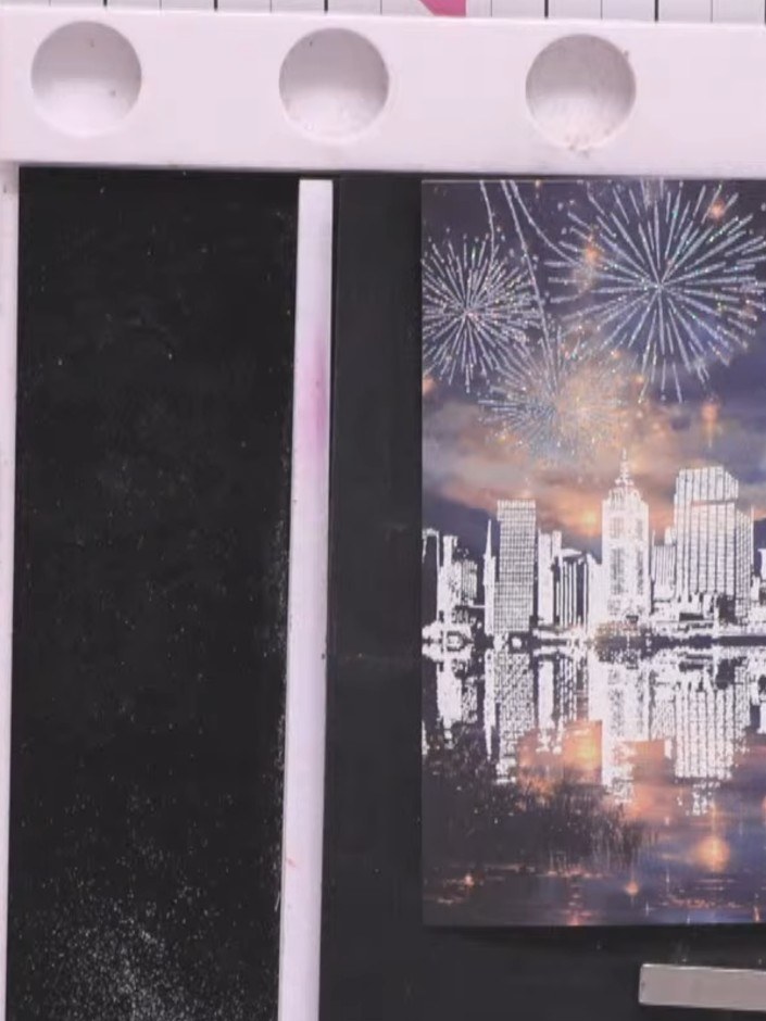 Step 7: Once the embossed piece has cooled completely, trim it down to size to fit your card front, ensuring the citys