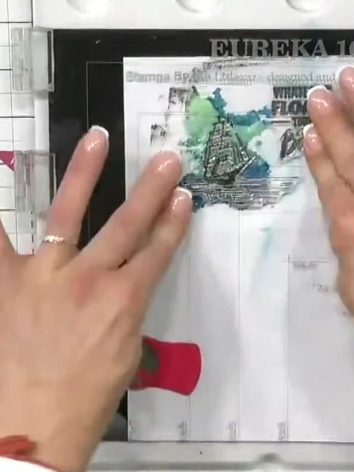 Step 5: Stamp the boat image in black ink over the dried watercolour background, positioning it centrally as your foca