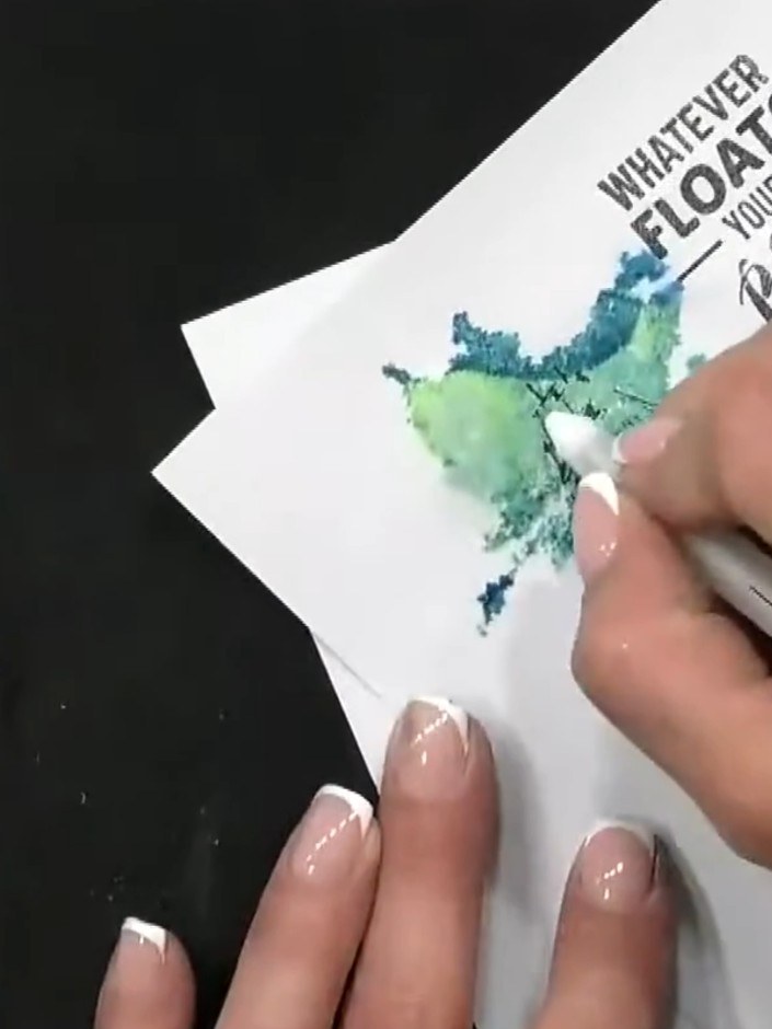 Step 7: Use a white gel pen to add highlights and details to the boat, following the existing lines to add dimension a