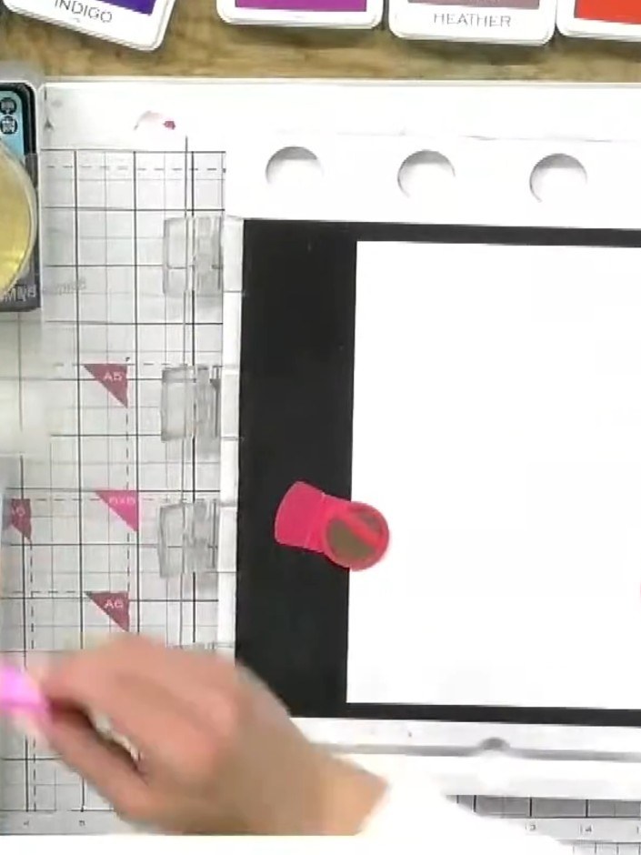 Step 2: Apply fandango pink ink to the middle section of the stamp using the ink pad, blending slightly with the magen