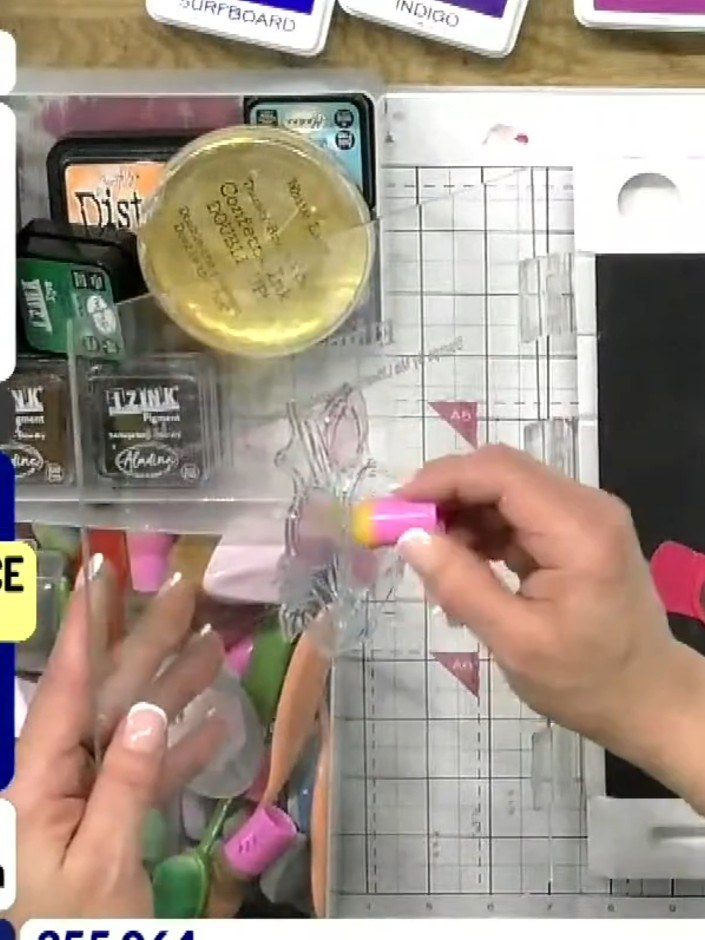 Step 4: Apply green ink to the stem and lower petal areas of the tulip stamp. Use the green ink pad to colour the appr