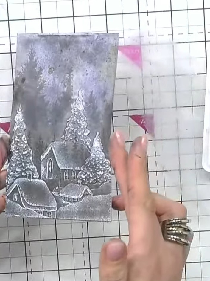 Step 7: Mount the finished embossed winter scene panel onto your card base. Add a sentiment to complete your card.