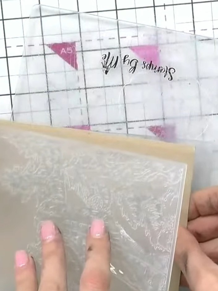 Step 1: Place your craft card into the embossing folder without inking it first. Position the card carefully within th