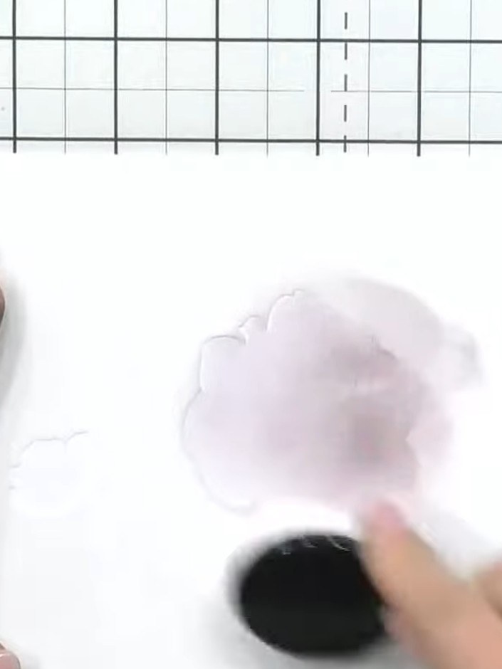 Step 5: Using a darker shade of lilac ink, tap colour through the stencil layer with a blending brush to add shading a