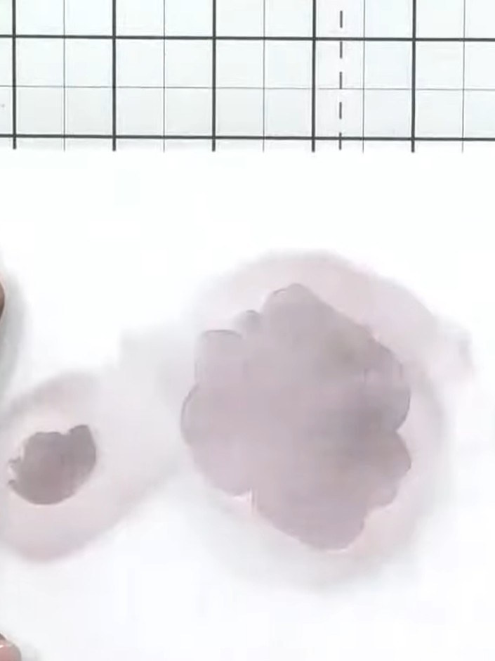 Step 6: Apply the darker purple ink through the third layer of the rose stencil, concentrating the colour in the centr