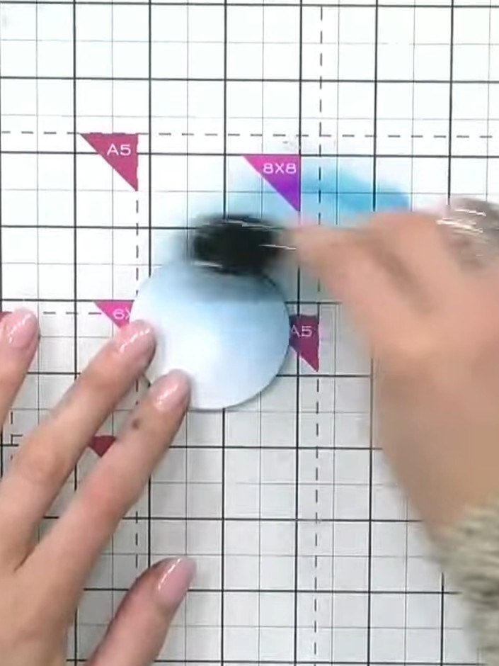 Step 3: Apply darker teal ink to one side of the circle to create shadow and dimension. Blend the ink to form a gradie