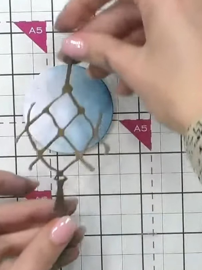 Step 8: Glue the wrap piece around the bauble, ensuring the decorative knobbles extend beyond the circle edge to creat