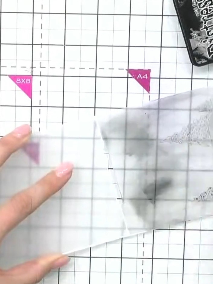 Step 1: Ink up both sides of the winter village embossing folder using the black Distress Ink pad. Apply the ink evenl