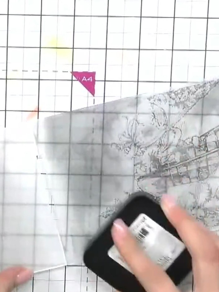 Step 2: Ink up both sides of the Santa embossing folder with a black ink pad, ensuring even coverage across the entire