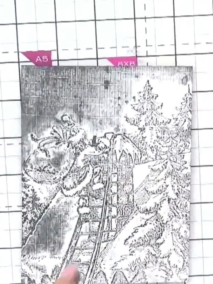 Step 6: Using a brush, apply red ink or watercolour paint to Santa's coat on the embossed image. Paint carefully to ad