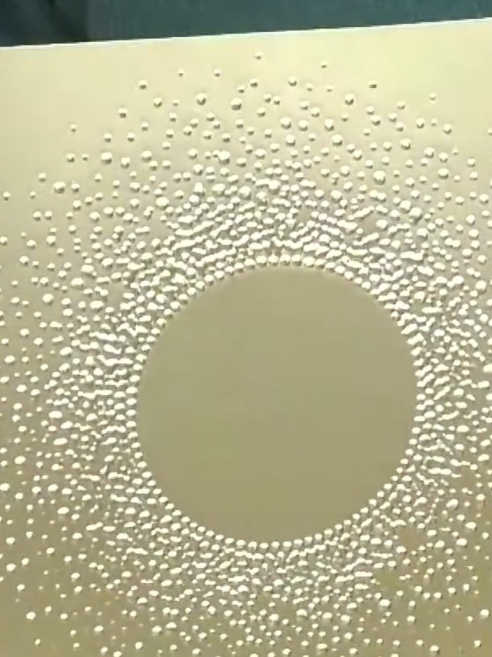 Step 5: Remove the card from the embossing folder and admire the dimensional snow burst effect created on the gold mir