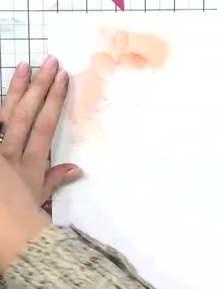Step 3: Position stencil number two over your first layer, lining up the four corner hearts to ensure proper alignment