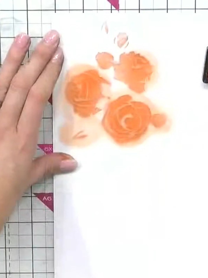 Step 5: Position stencil number three over your design and apply pink ink using a blending tool to add variety and dep