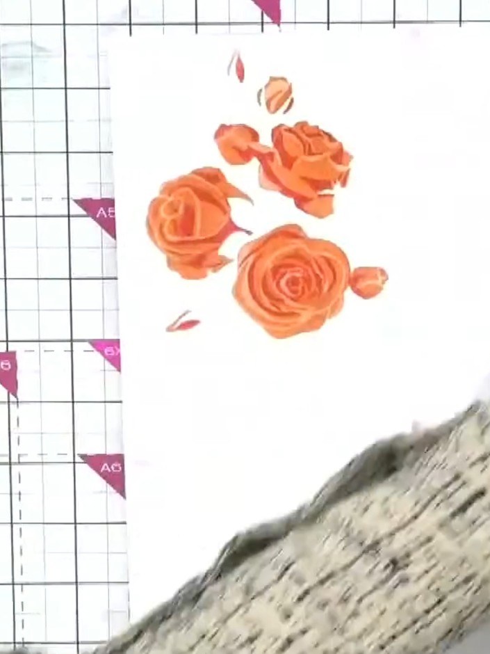 Step 8: Once the stencilled layers are complete, use the coordinating rose dies to cut out the flower shapes. This cre