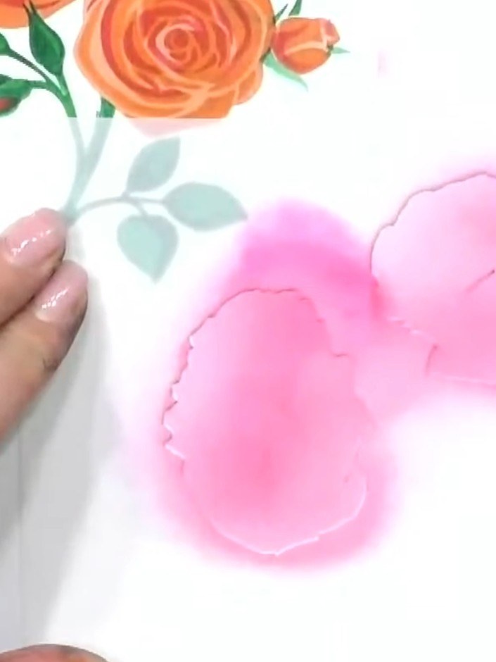 Step 2: Select pink ink and use a blending brush to apply colour through the first layer of the poppy stencil onto you