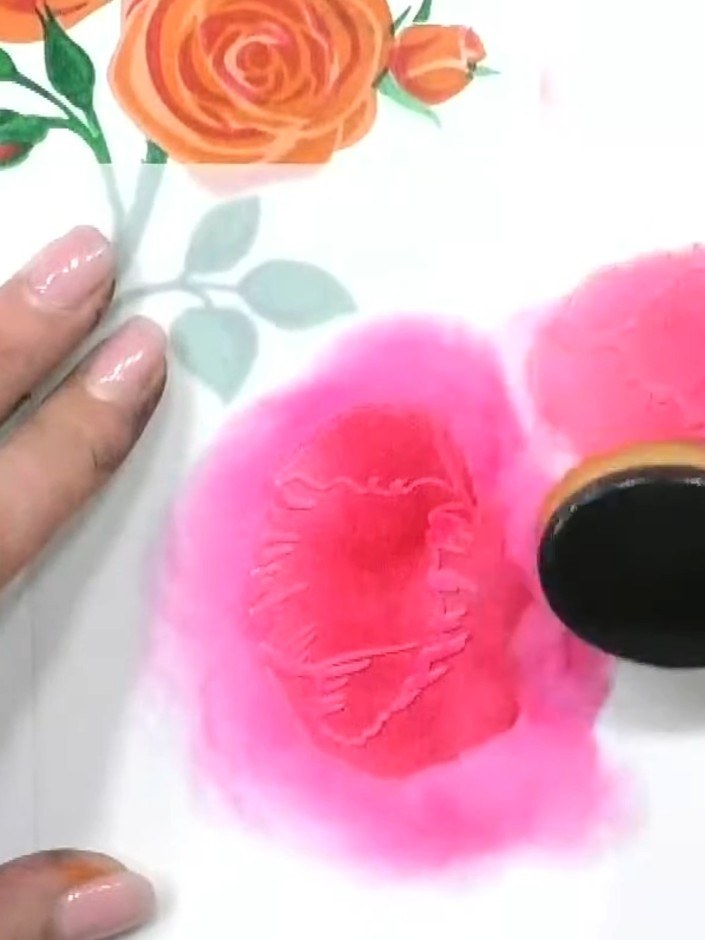 Step 4: Apply pink ink through stencil number two using a blending tool, pressing firmly to achieve good colour covera